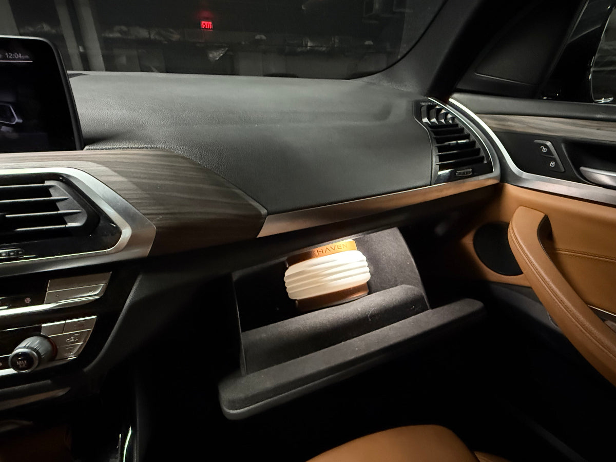 Car interior with a collapsed HAVEN solar portable lantern in the glove compartment in case of breakdowns and emergencies.