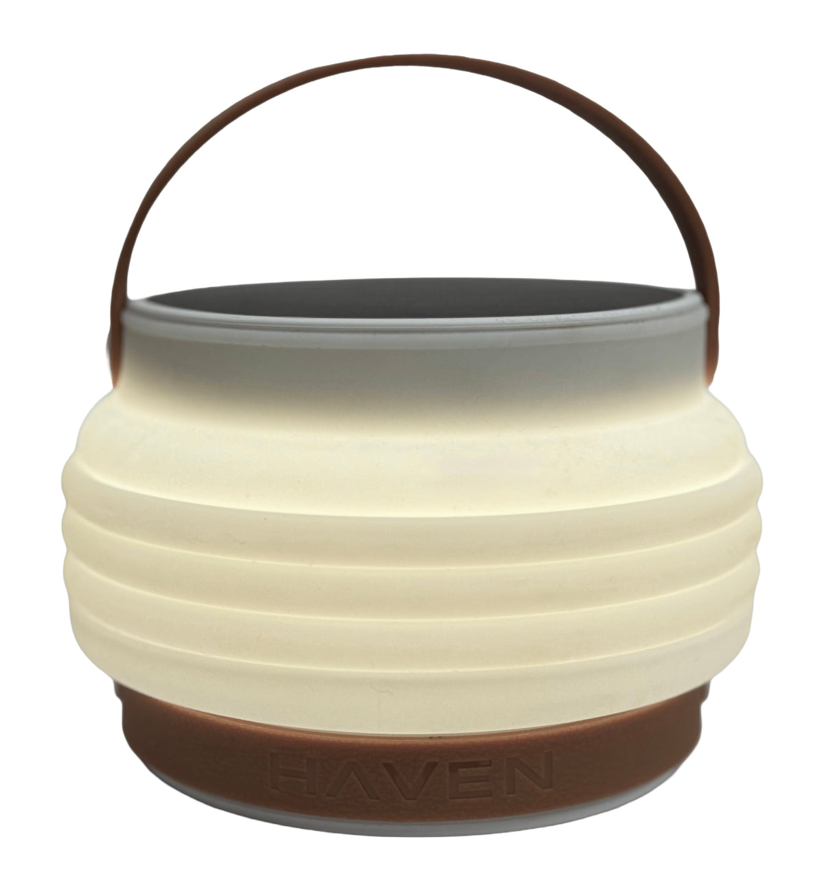 Product shot of HAVEN portable solar lantern collapsed with adjustable handle up.  