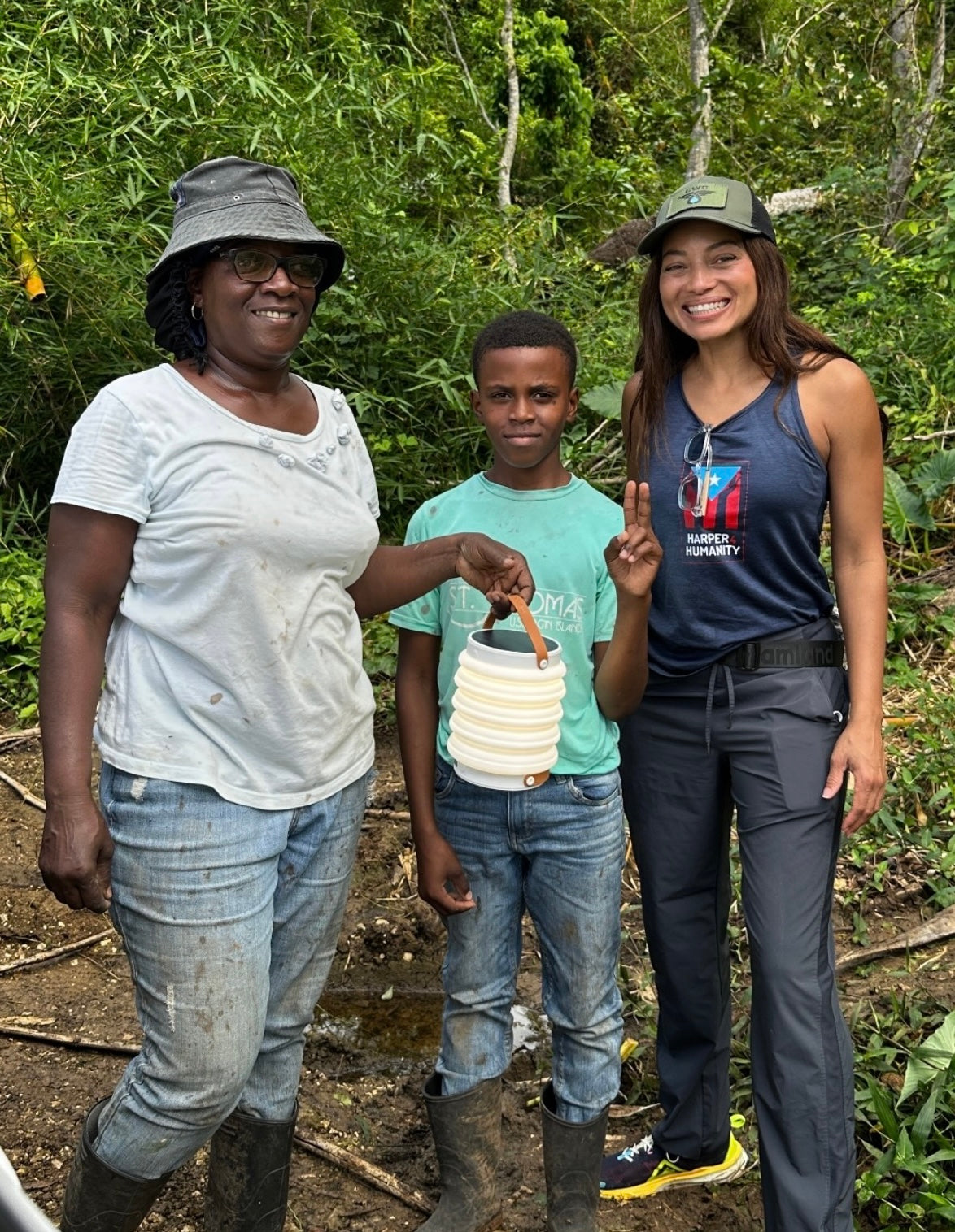 Jamie Harper in Jamaica for Hurricane Melissa Humanitarian Relief giving HAVEN Lantern + Power Bank to Mother and Son