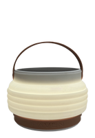 Product shot of HAVEN portable solar lantern collapsed with adjustable handle up.  