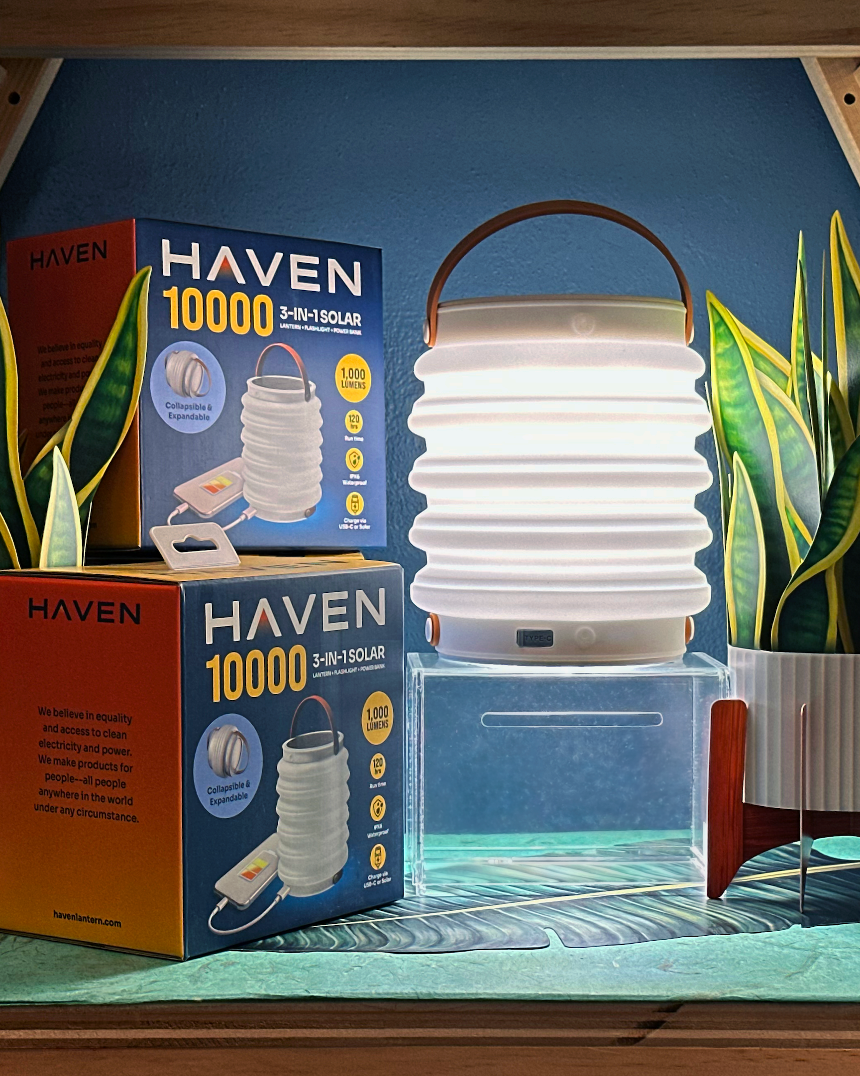  Haven 10000 3-in-1 Solar lantern with packaging on a table at Sam Flax Florida.