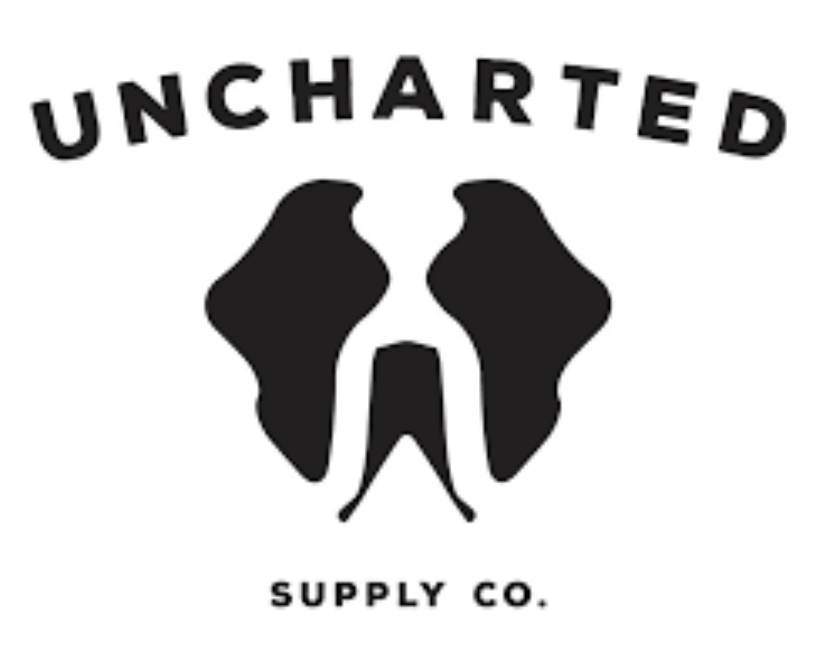 Logo of Uncharted Supply Co. with black text and shapes on a white background