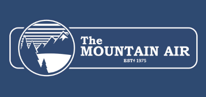 The Mountain Air logo in white on a dark blue background, featuring a mountain and sun graphic inside a rounded rectangle with the text 'The MOUNTAIN AIR' and 'EST. 1975'.